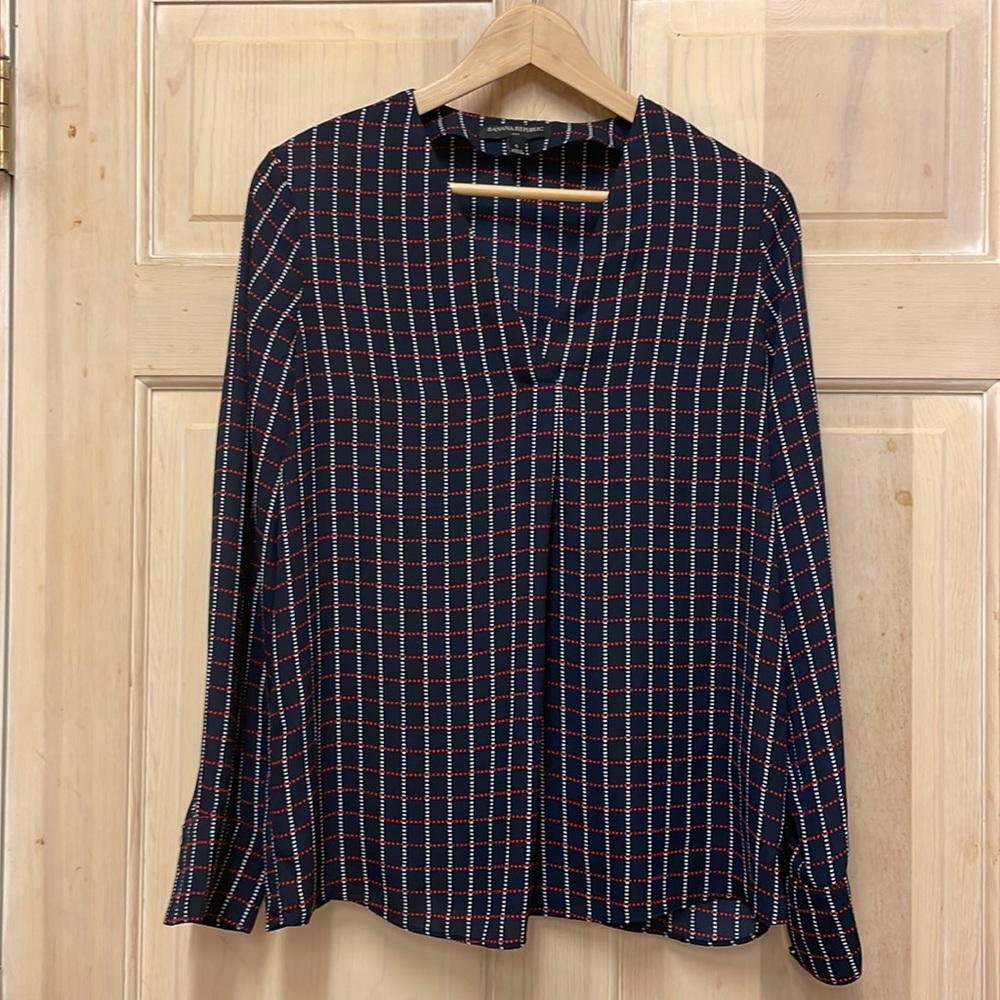 Long sleeve work blouse, navy with white and red detail.